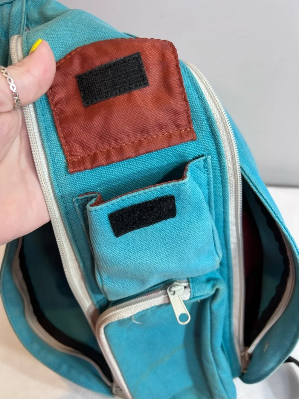 Kavu teal rope sling bag backpack